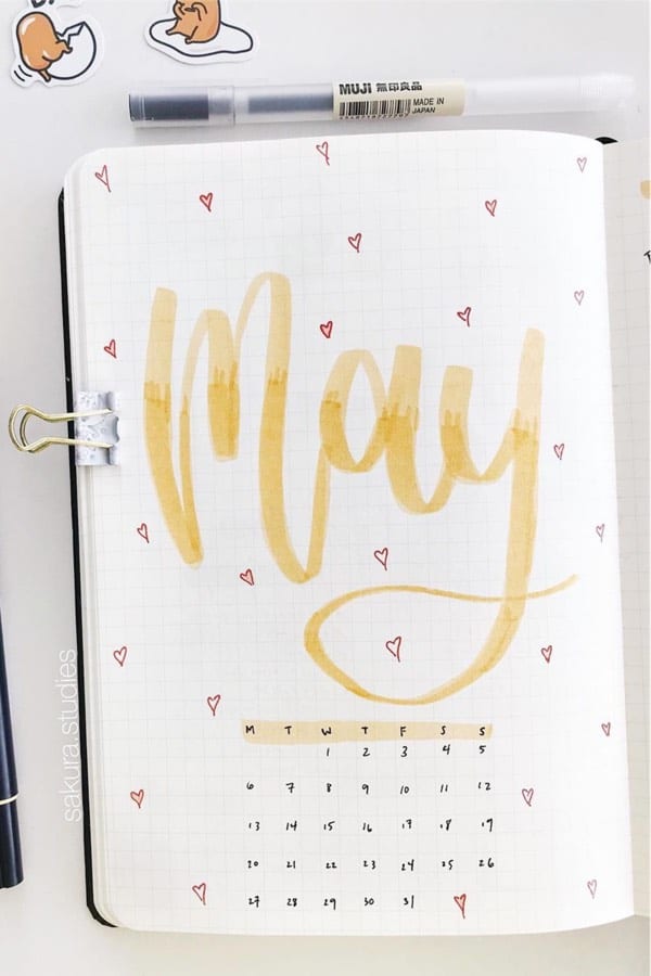 may bujo spread with yellow