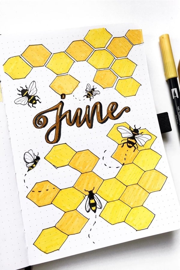 bullet journal spread with bee hive