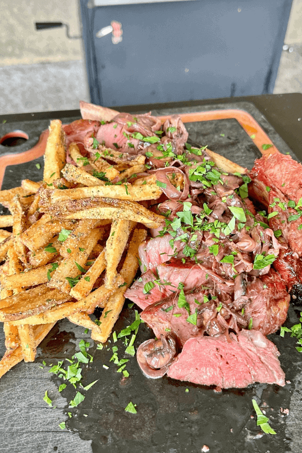 Grilled Ribeye Steak with Red Wine Onion and Mushroom Sauce